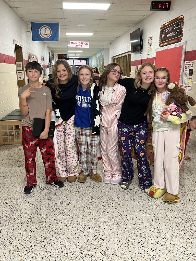 Students pose in their pajamas.