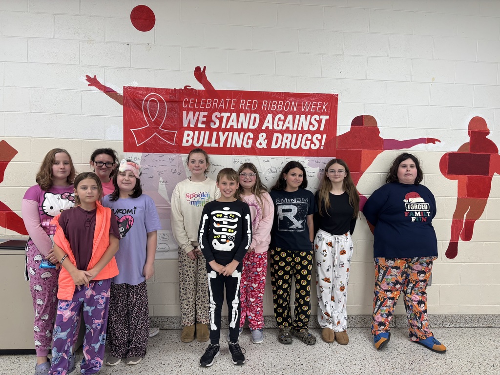 Students pose in their pajamas.