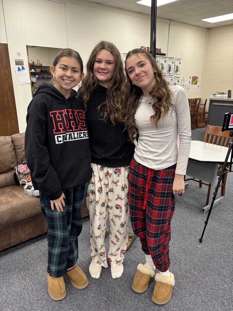 Students pose in their pajamas.