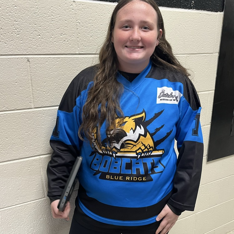 A student poses in a team jersey.