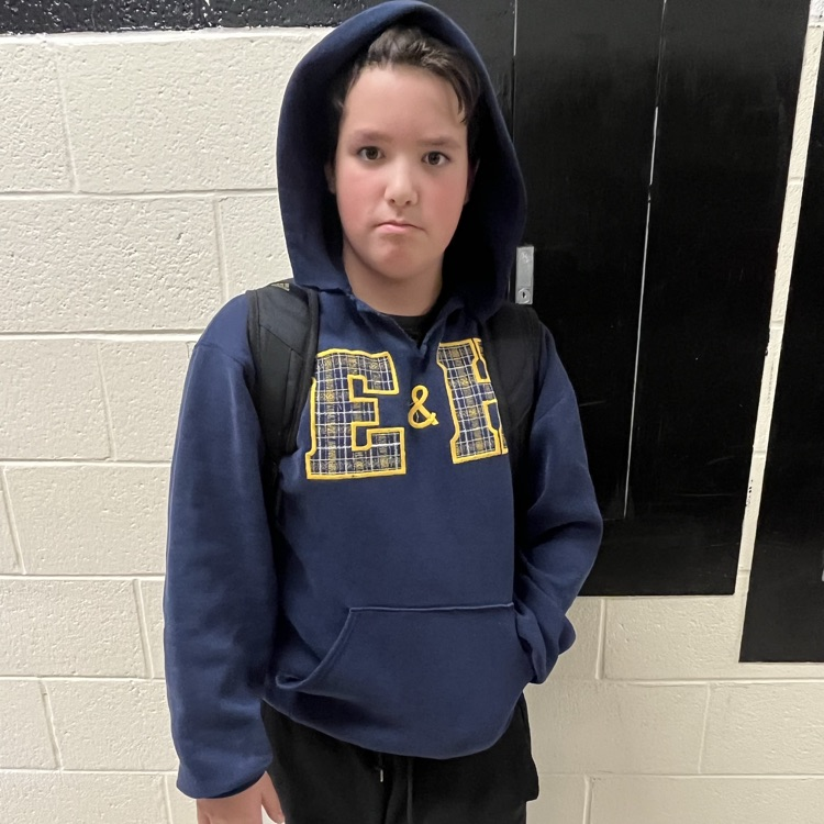 A student poses in a team jersey.