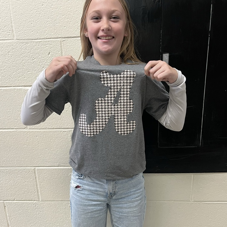 A student poses in a team jersey.