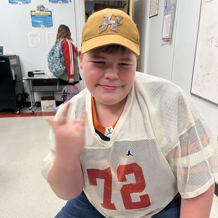 A student poses in a team jersey.