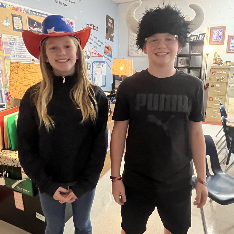 Students pose in western wear.