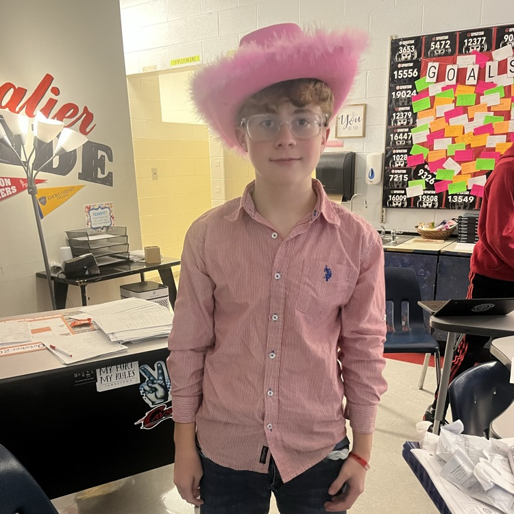 A student poses in a cowboy hat.