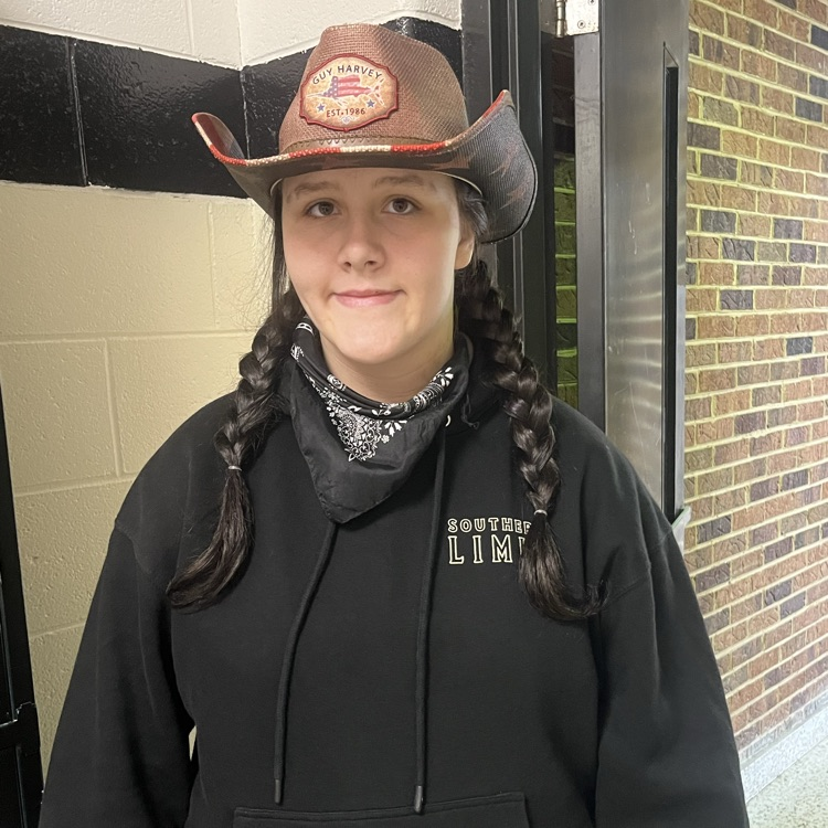 A student poses in a cowboy hat.