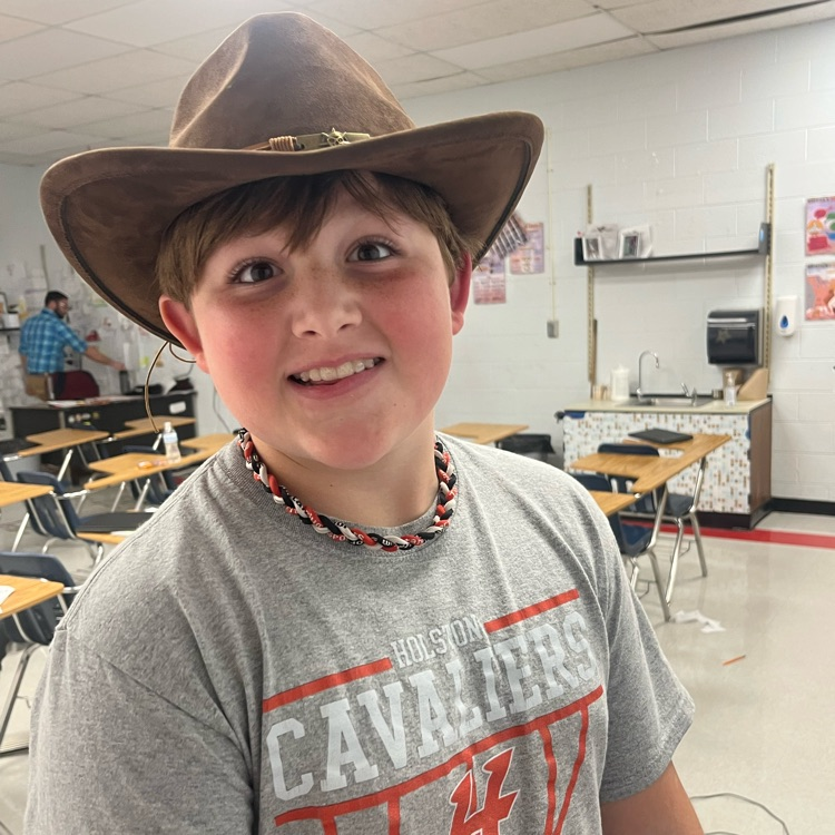 A student poses in a cowboy hat.