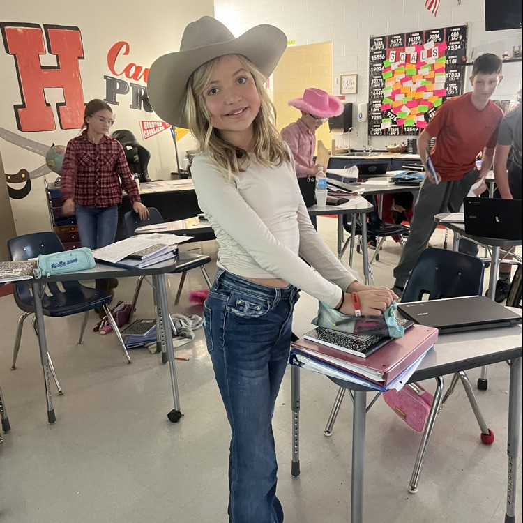 A student poses in a cowboy hat.