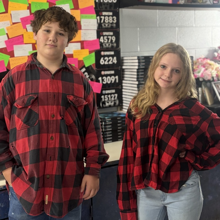 Two students are dressed alike.