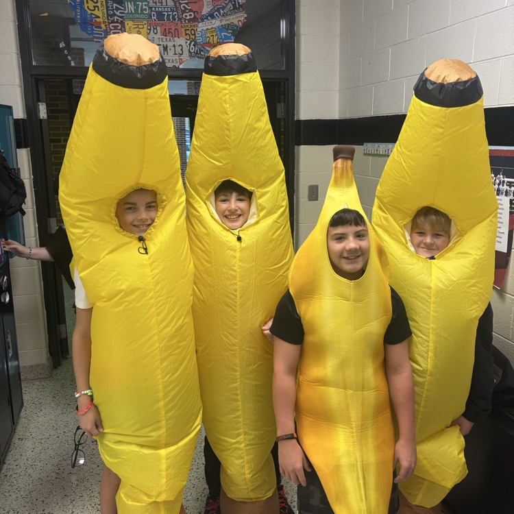 Four students are dressed alike.