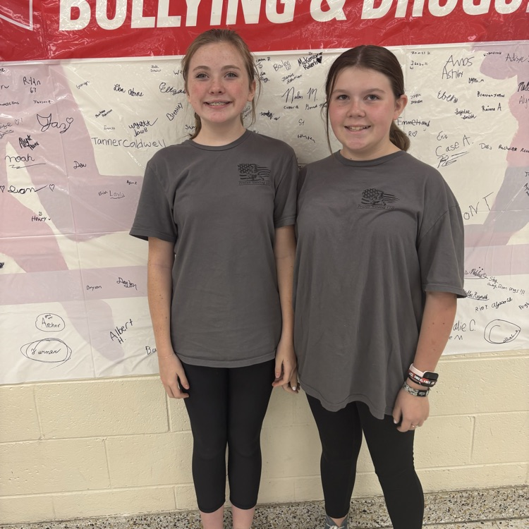 Two students are dressed alike.