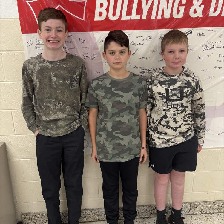 Three students are dressed alike.