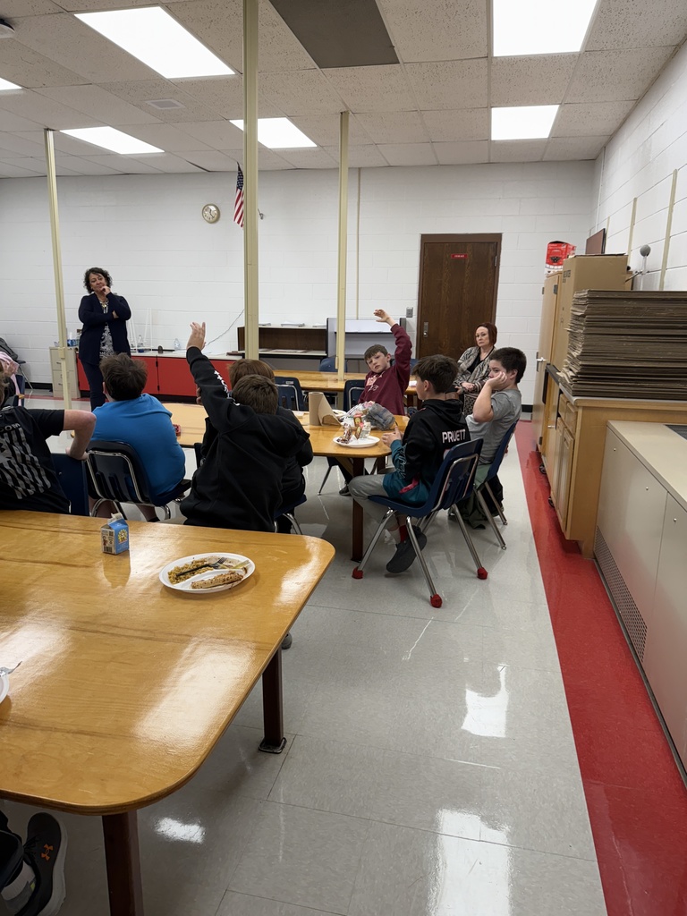 Students ask questions and a woman answers.