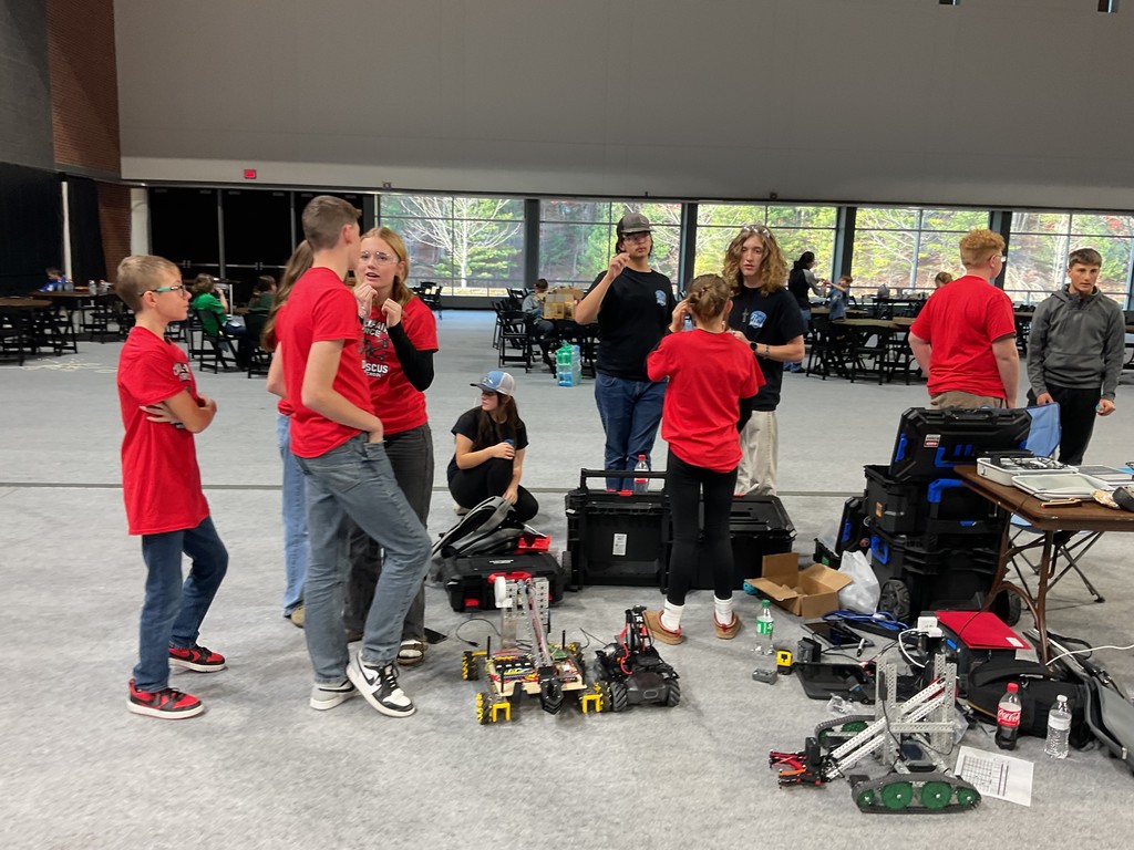 Robotics students work together.