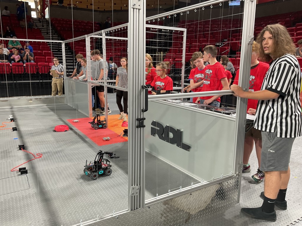 Robotics students work together.