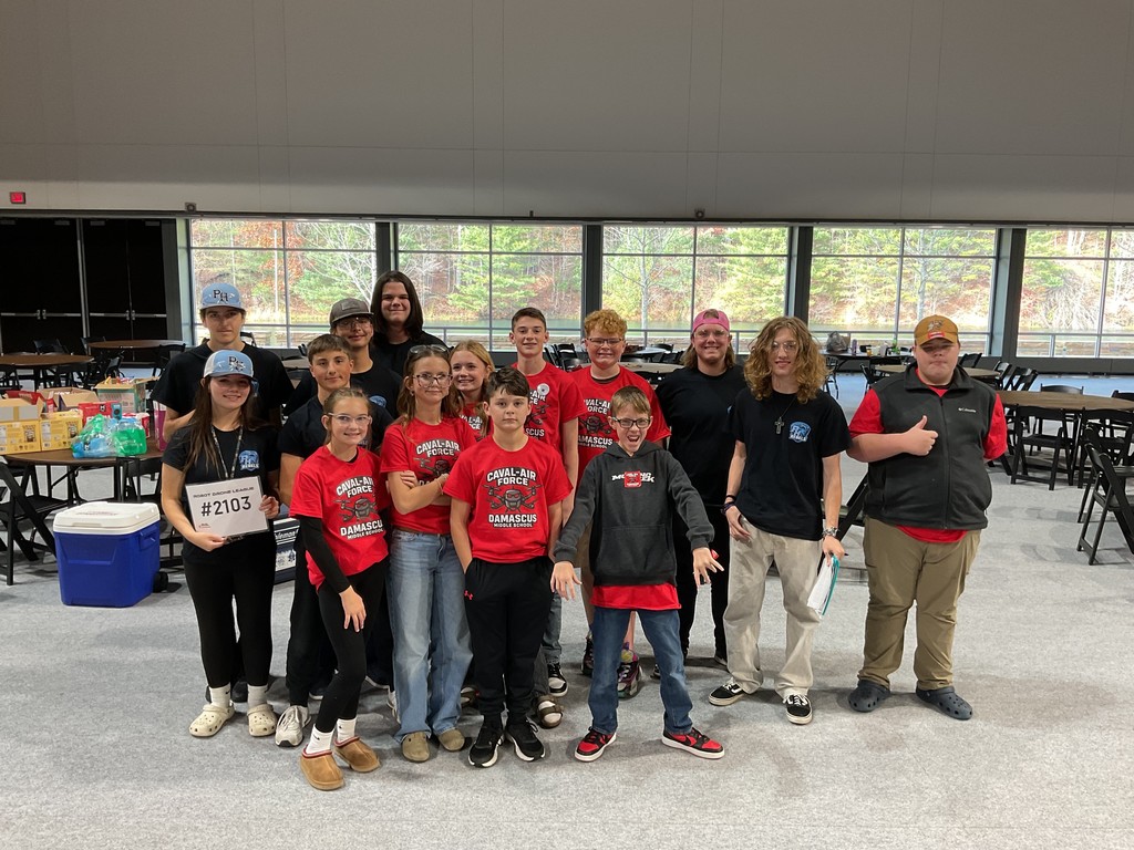 Robotics students work together.