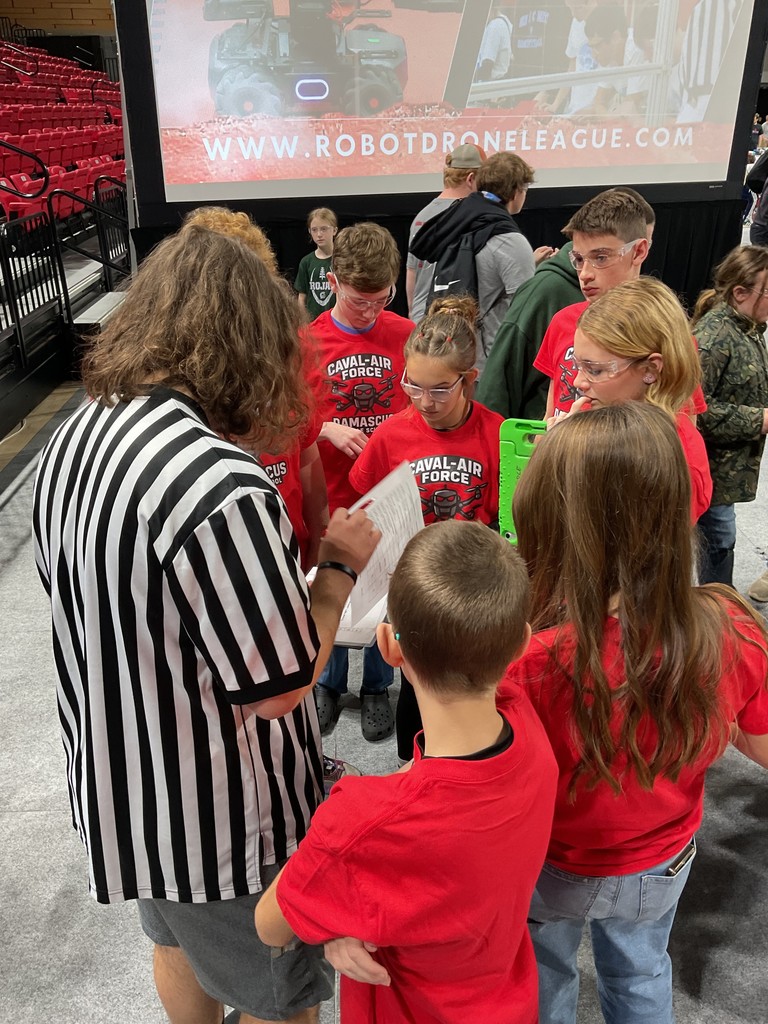 Robotics students work together.