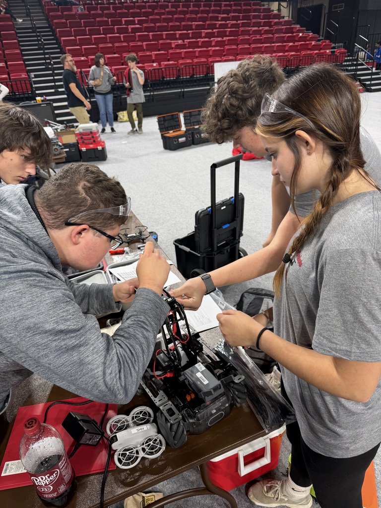 Students work with robotics.
