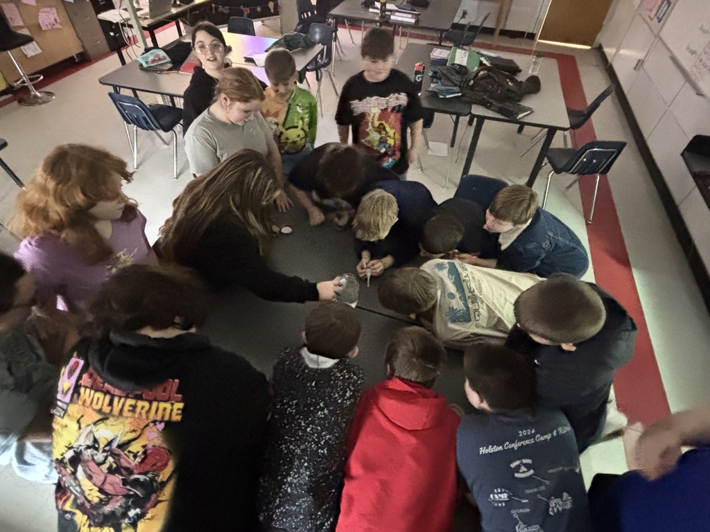 Students teach their classmates in a classroom.