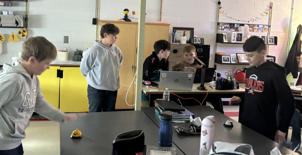 Students teach their classmates in a classroom.