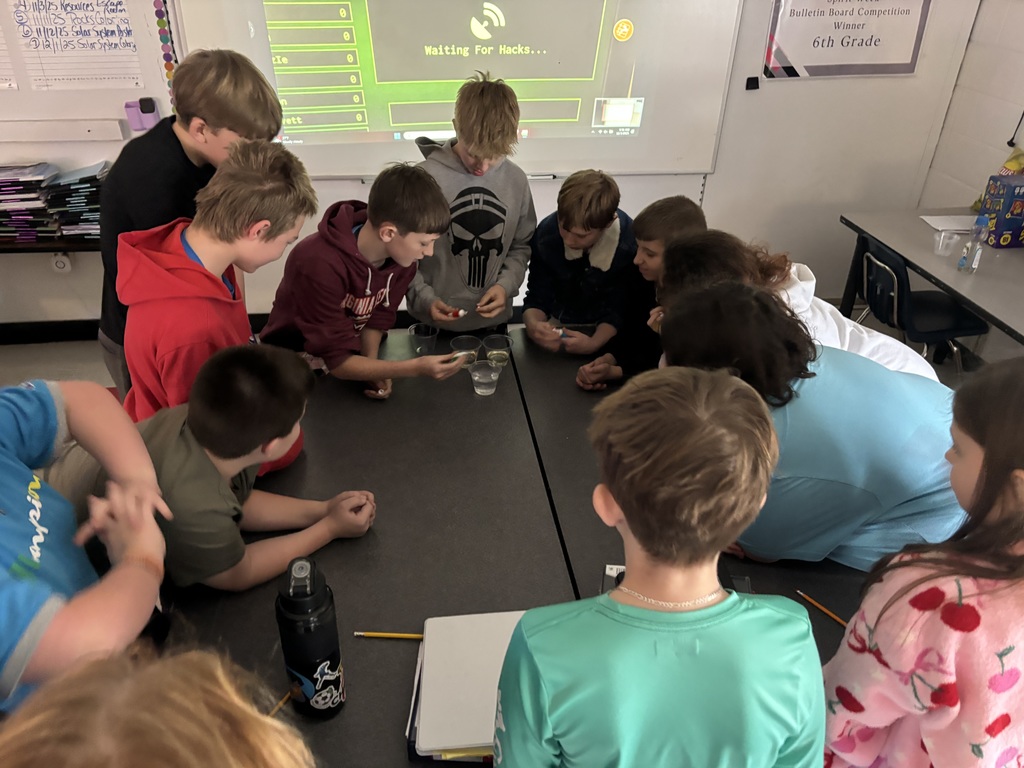 Students teach their classmates in a classroom.