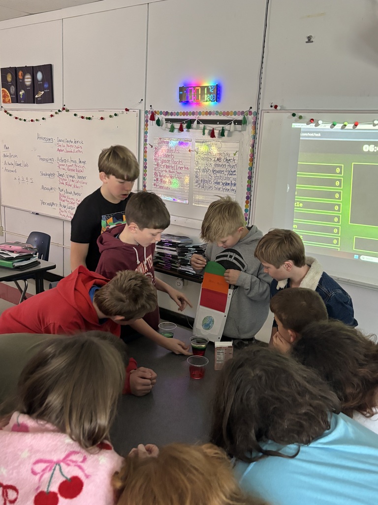 Students teach their classmates in a classroom.