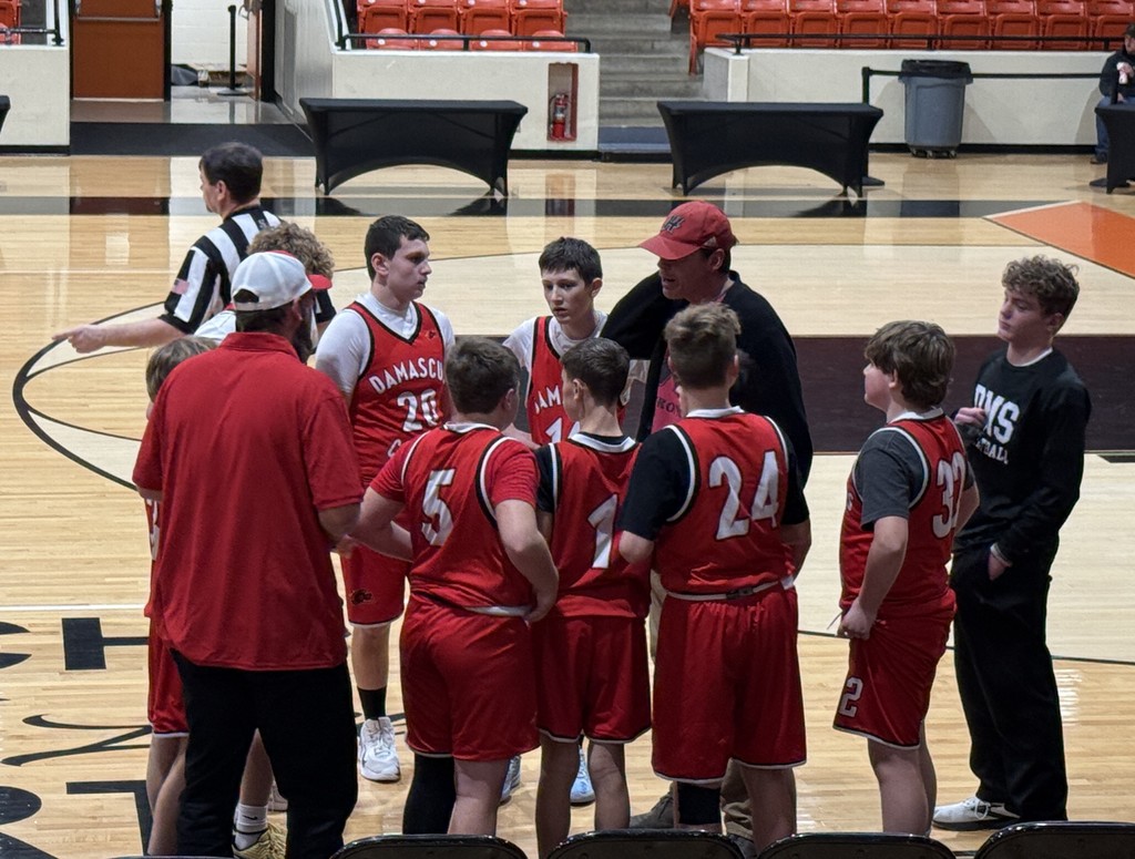 A basketball coach talks to his players.