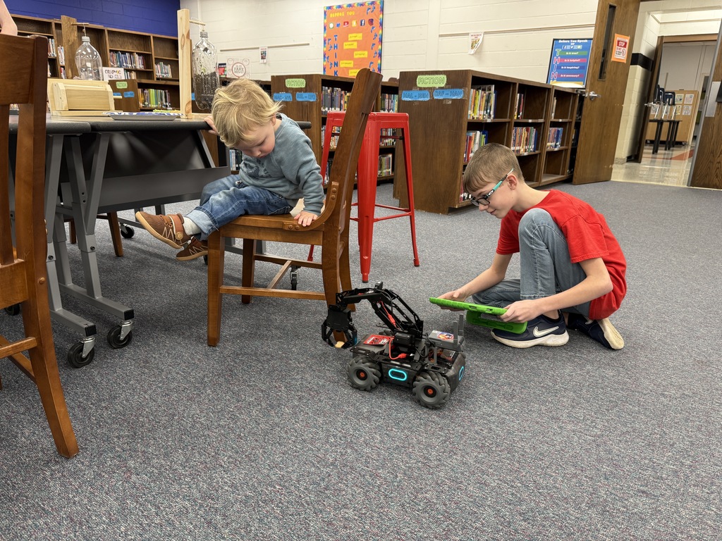 A student demonstrates a robot.