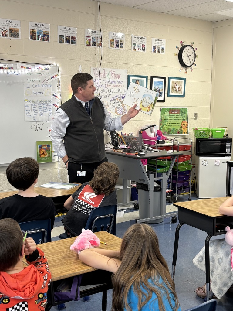 man reading to students