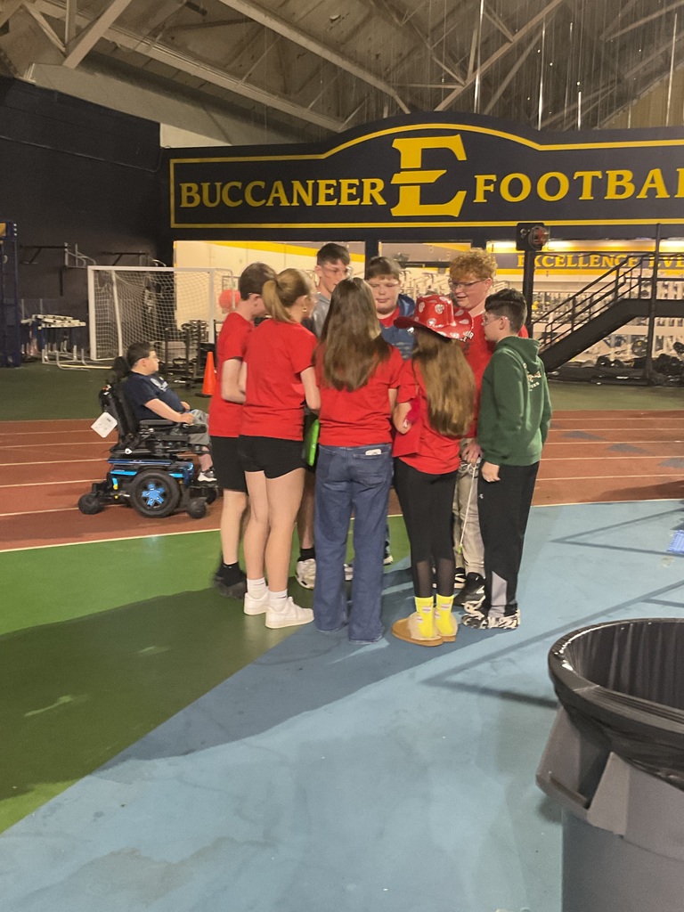 Students prepare to compete in a robot drone league championship.
