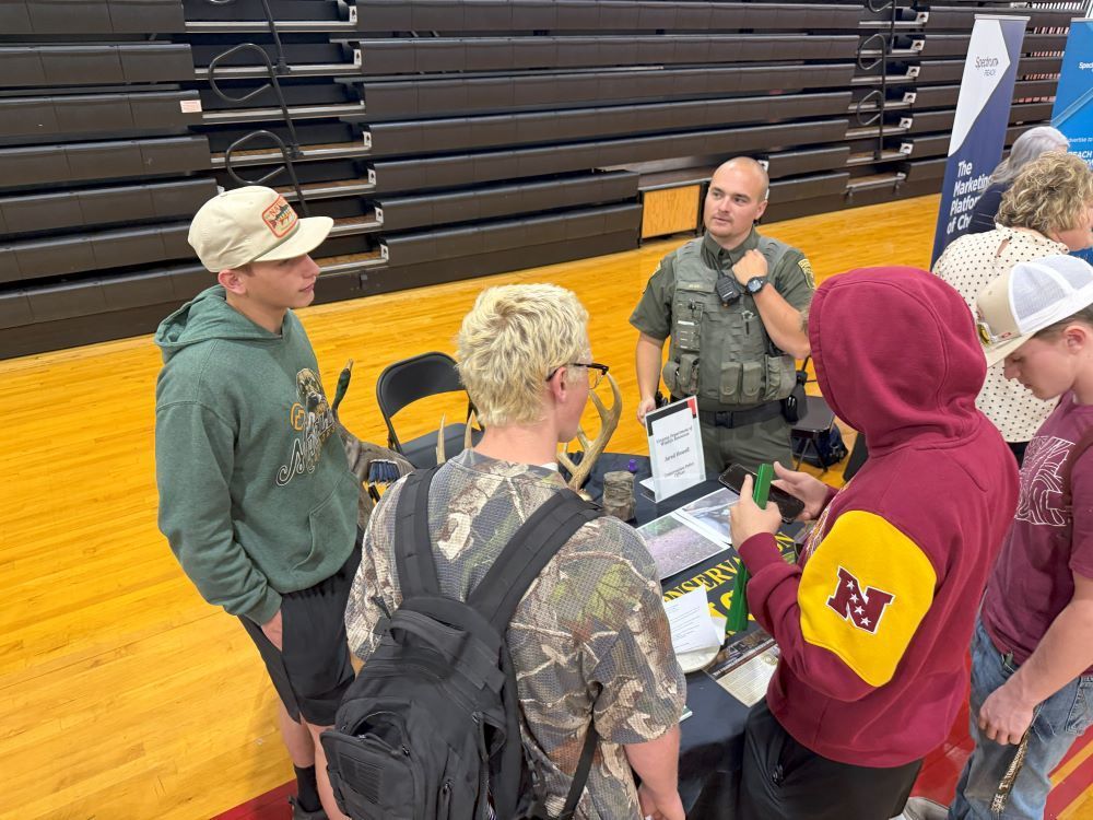 A man talks to a group of students about his career.
