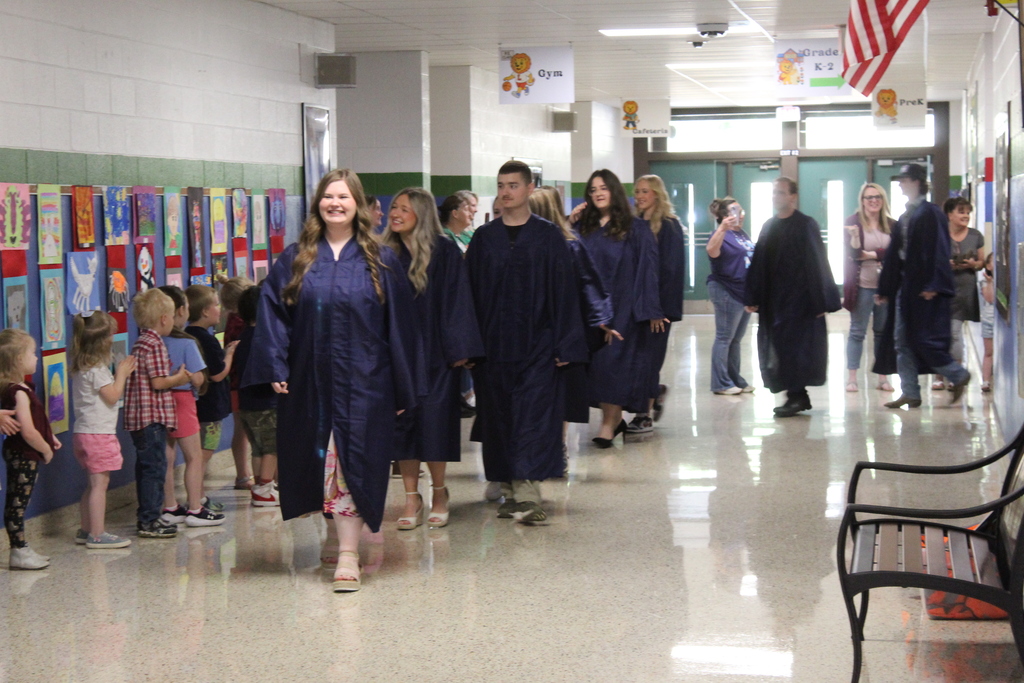 graduates walking the halls