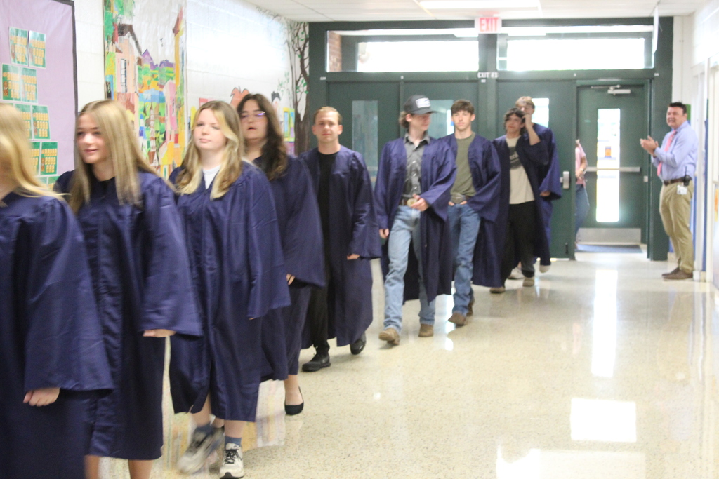 graduates walking the halls