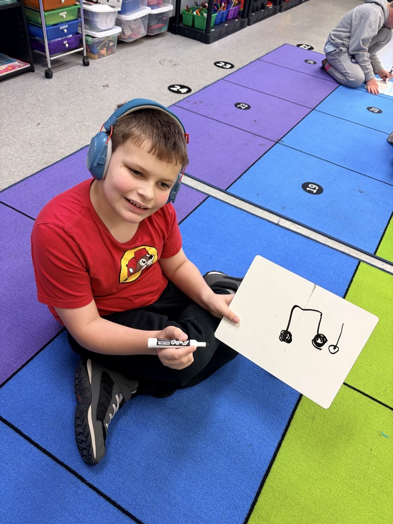 Students in 2nd grade notating rhythm patterns.