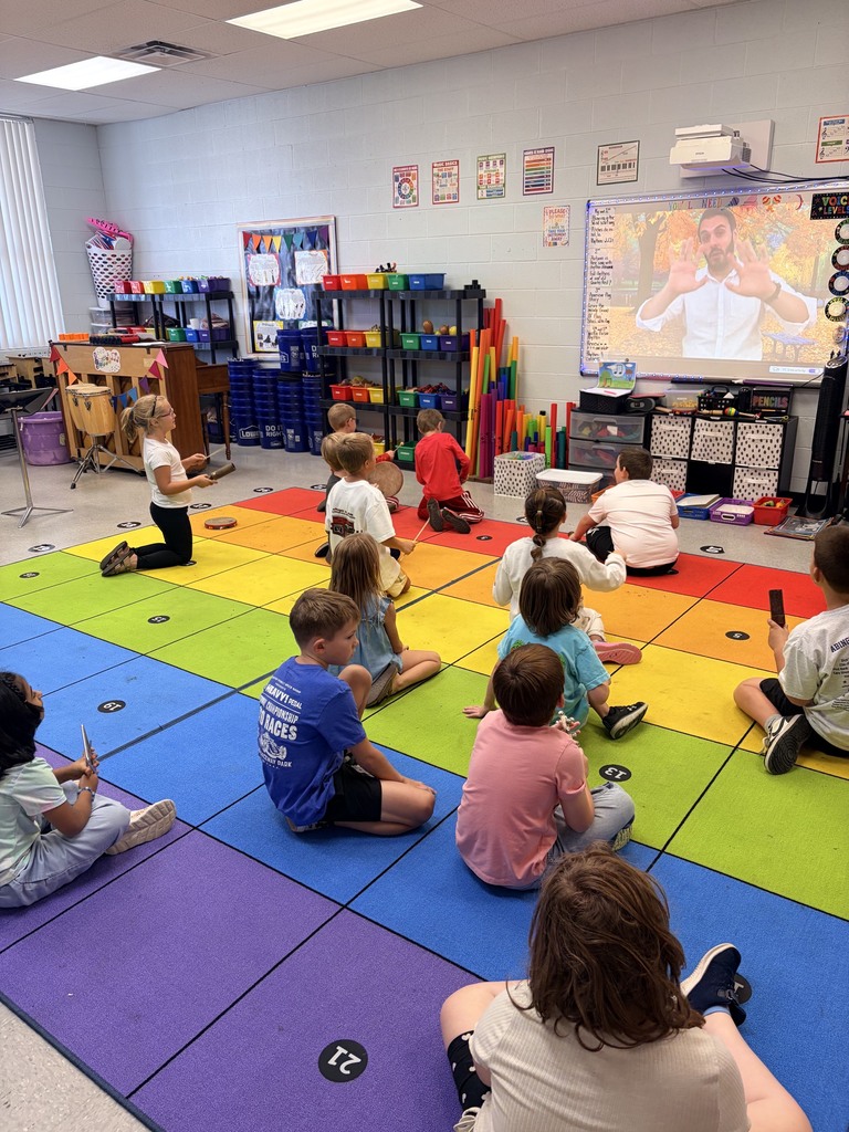 Ms. McCalls class playing rhythm instruments to the song “Autumn is Here”.