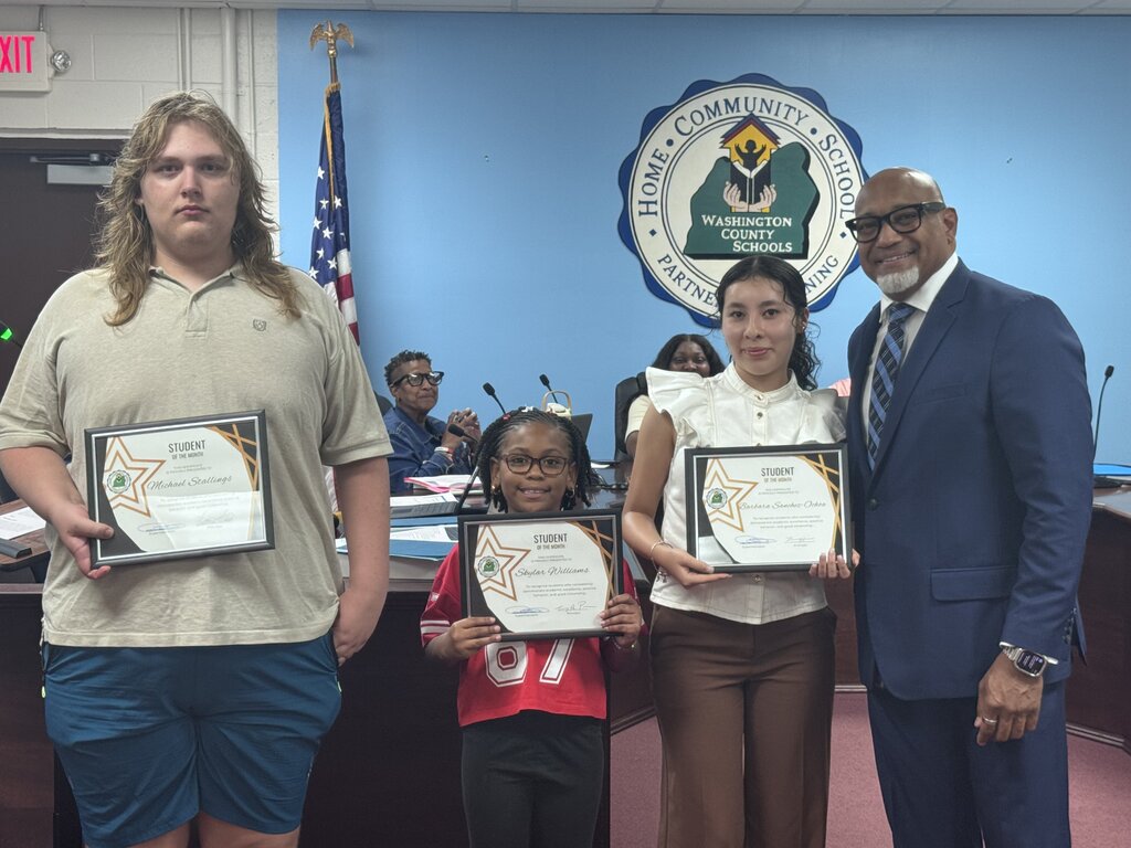 supterintendent with students of the month for September 2026