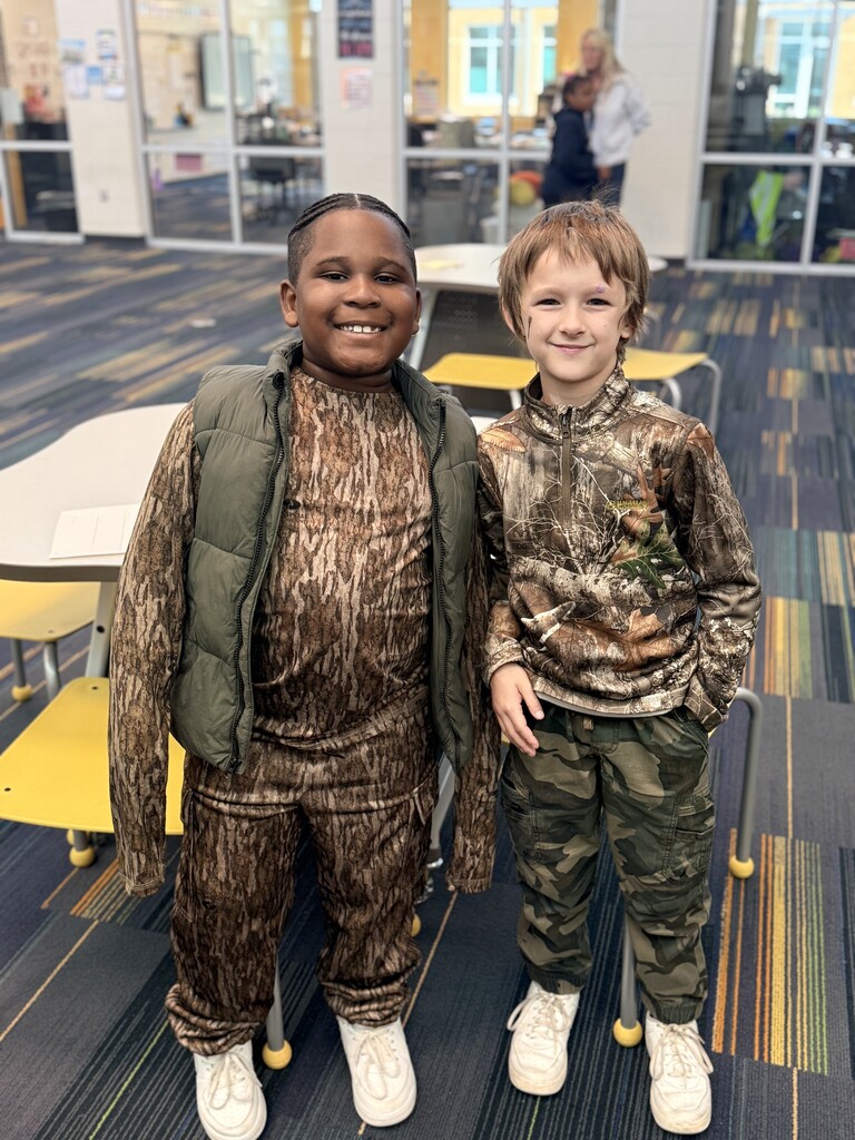 2 students wearing camo.