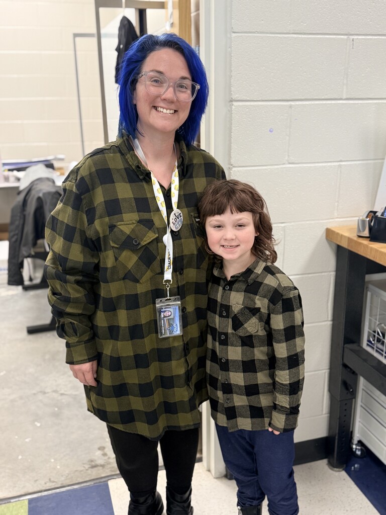 Mrs. Standle and a student wearing green flannel.