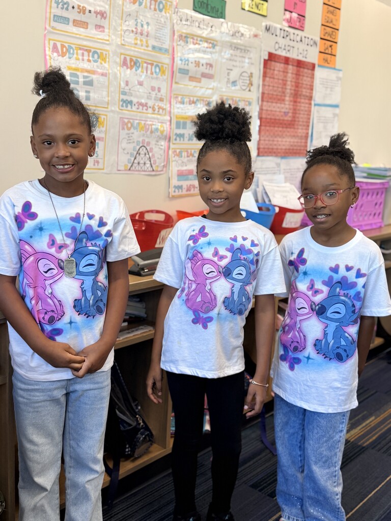 Triplets rocking Stitch shirts and jeans.