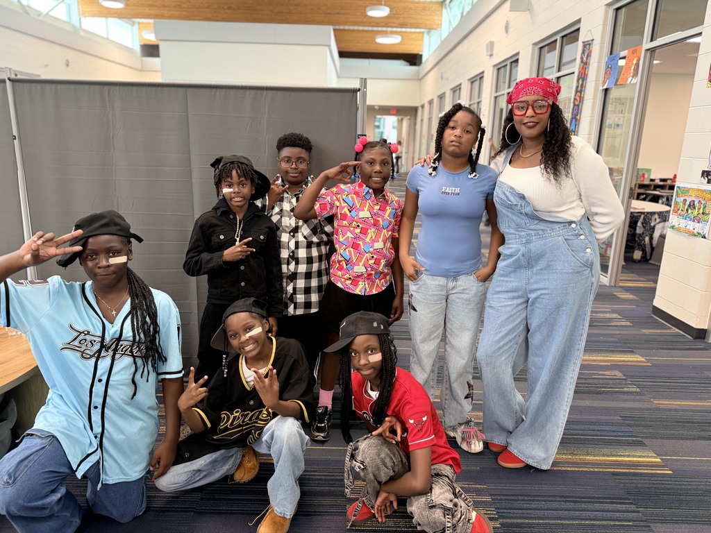 Some of Ms. Morgan's fifth grade students with bandaids on their faces.