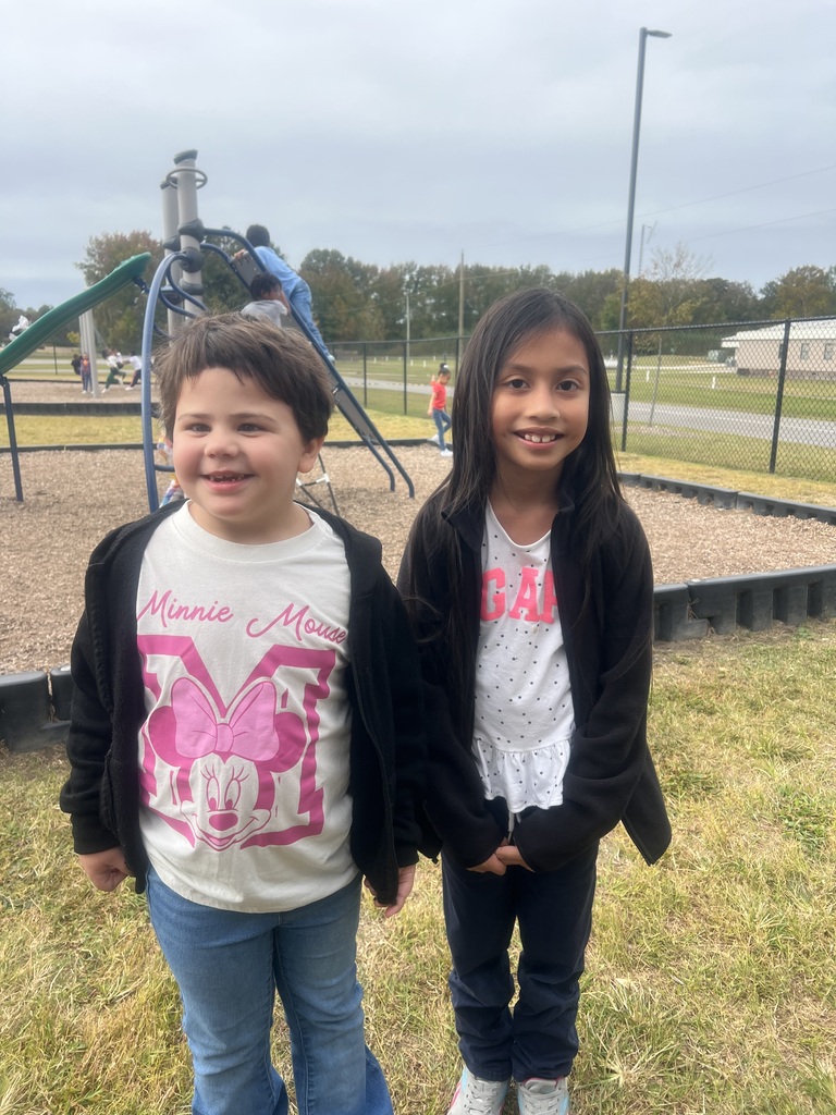 2 students wearing blck jackets and jeans for twin day.