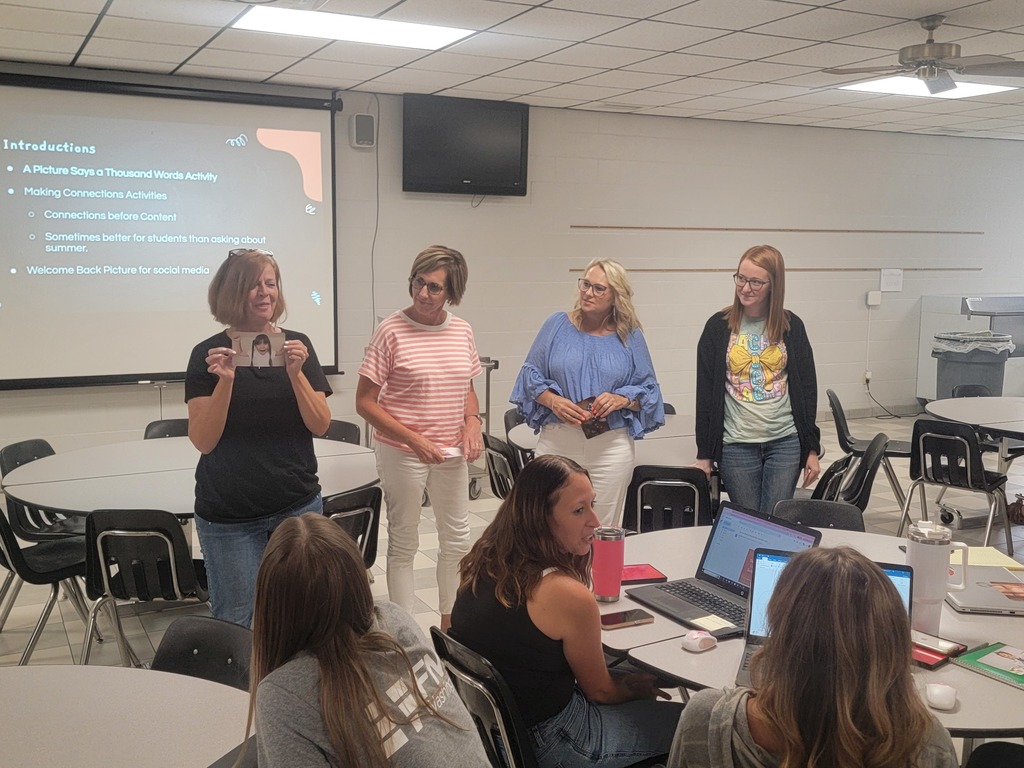 WCES staff doing an activity with explaining a card