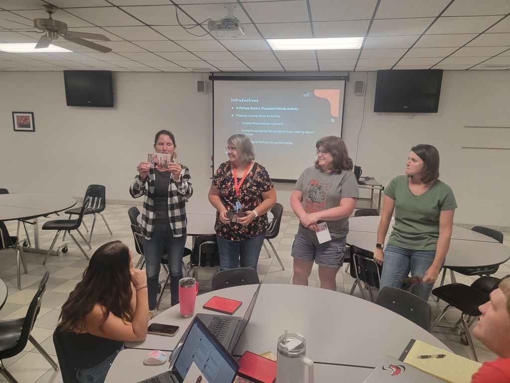 WCES staff doing an activity with explaining a card