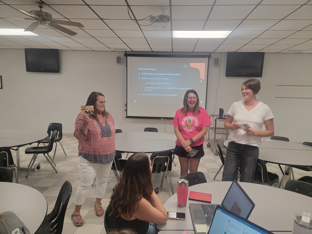 WCES staff doing an activity with explaining a card