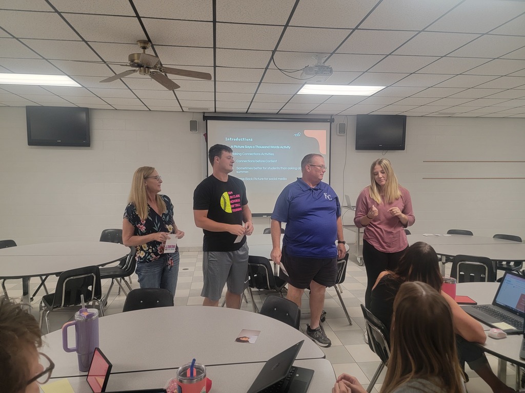 WCES staff doing an activity with explaining a card
