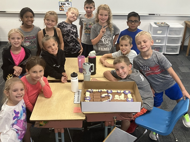students with a cake