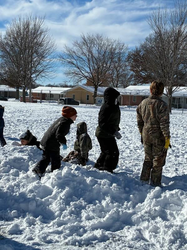 kids playing in the snow