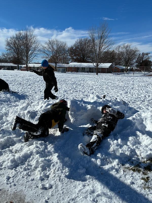 kids playing in the snow