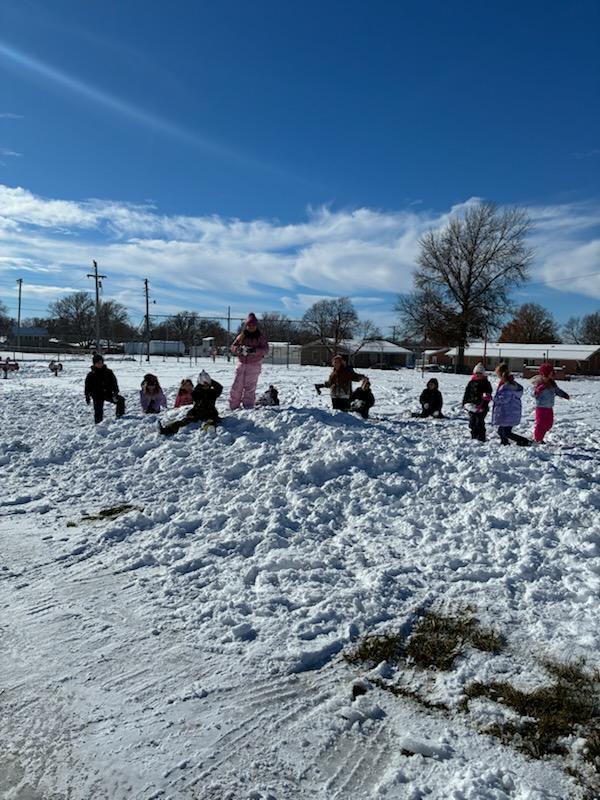 kids playing in the snow