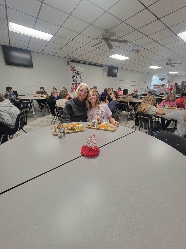 Students with December birthdays eating lunch with family and friends.